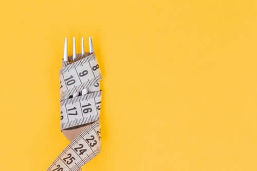 Fork with measuring tape wrapped around it