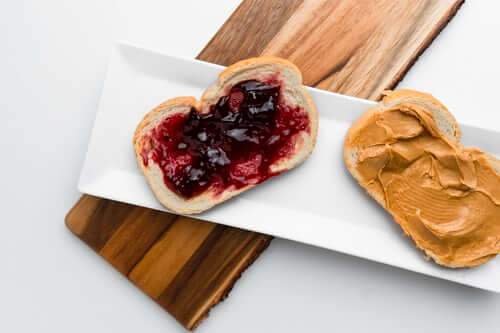 peanut butter and jelly on bread on white plate